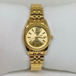 Eternity gold tone women watch 25mm round case quartz analog size 6” running